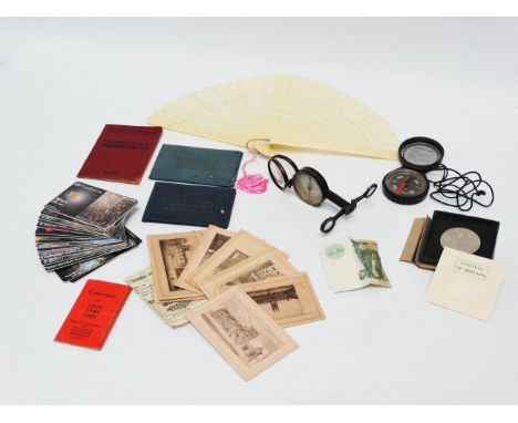 A military compass/heliograph - together with another compass and other sundry items including Russian phone cards, a £1 bank