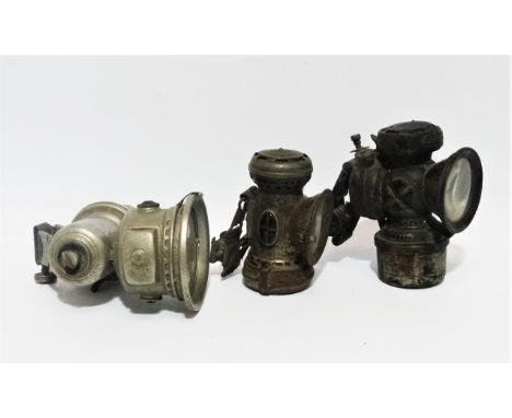 A Joseph Lucas carbide cycle lamp - nickle plated, height 18cm, together with two further cycle lamps. 