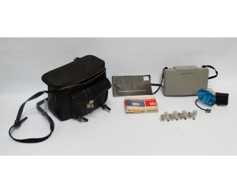 A Polaroid Automatic 103 Land camera - together with flash bulb, instruction manual and cold clip.