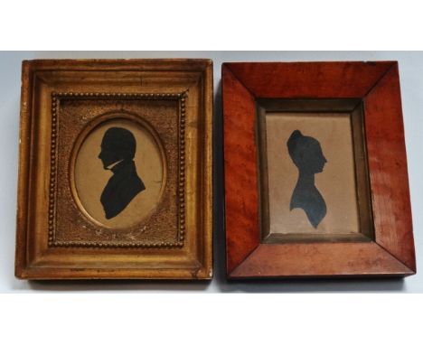 An early 19th Century silhouette portrait of a gentleman - with high collar and framed as an oval, 8cm x 6cm, together with a
