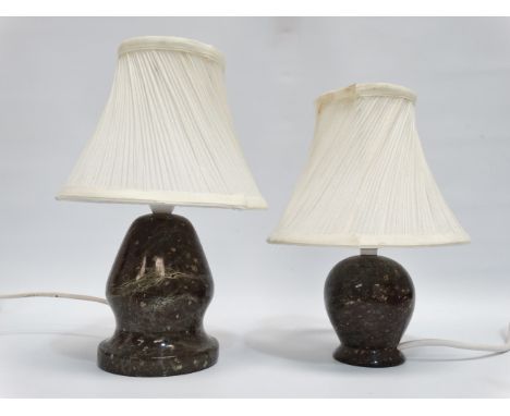 A serpentine table lamp - of globe form with a foot rim, height 12cm, together with another similar lamp, (2)