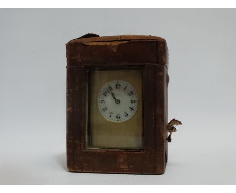 An early 20th century Grand Sonnerie carriage clock - with a brass corniche case, the white enamel dial set out in arabic num