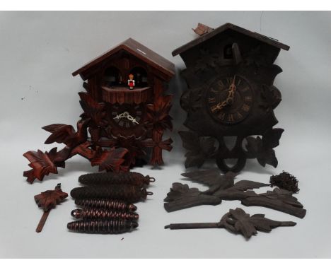 A 20th century German cuckoo clock - in a traditional case with dancing figures on the hour, height 30cm, another similar ear