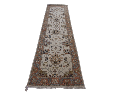 A 20th century Indian wool runner - 'Ivory and Rust' pattern, 90 x 348cm.