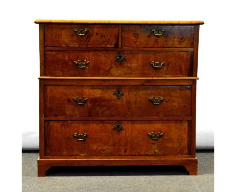 Walnut chest of drawers, 18th Century and later, the top with broad crossbanding and moulded edge, two short and three long g