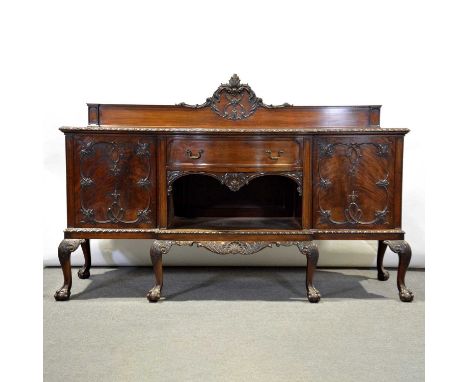 Suite of mahogany furniture in the Chippendale style, early 20th Century, comprising a bowfront sideboard, carved back, fitte