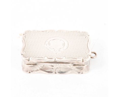 Victorian silver vinaigrette, WN, Birmingham 1862, rectangular with serpentine edge, engine turned and with blank strap carto