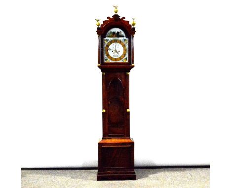 Mahogany longcase clock, the arched hood with brass finials, cavetto cornice, fluted columns, trunk with long lancet topped d