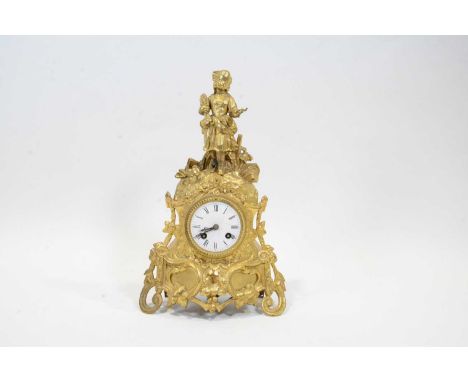 Late 19th Century French gilt spelter mantel clock, figural surmount, circular white enamelled dial with Roman numerals, cyli