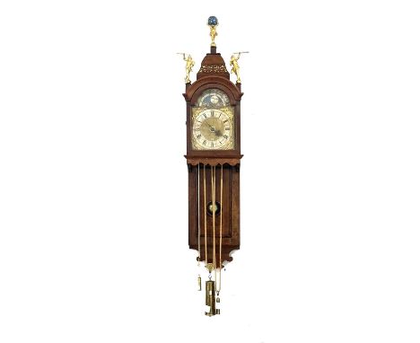 Dutch walnut wall clock, 18th Century, casket top with figures, the case with a long rectangular panel, with glass lenticle, 