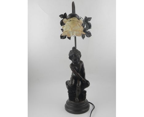 In the style of Moreau, a spelter figural table lamp, having glass lamp shade, H. 56cm 