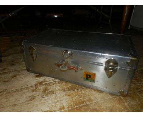 A aluminum and brass mounted steamer trunk. W.86cm H.31cm D.48cm
