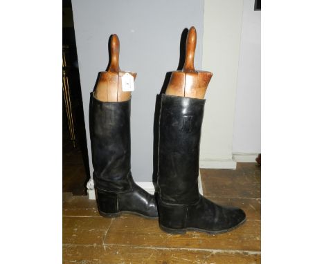 A pair of black leather gentleman's hunting boots, approx. size 10, together with a pair of wooden boot trees. 