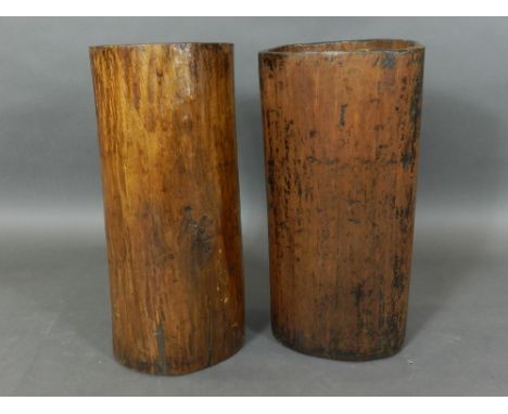 A pair of early 20th century hardwood stick stands, of naturalistic form. H: 55cm