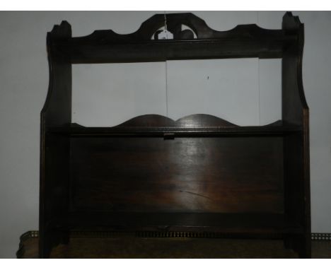 An oak wall hanging shelf unit.