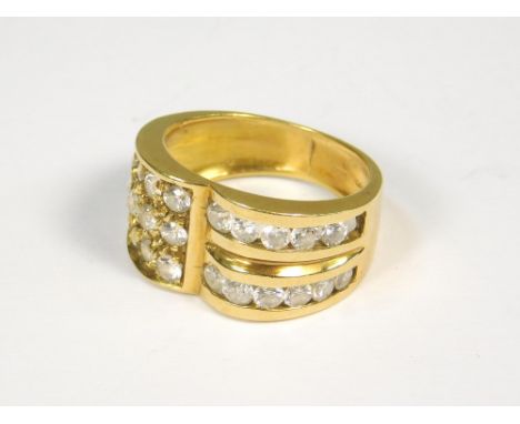 COCKTAIL RING. An 18ct. gold cocktail ring, one side set with three rows of five diamonds. The other side with two rows of fi