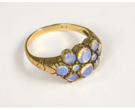 OPAL RING. A 9ct. gold opal multi-stone ring. (M)