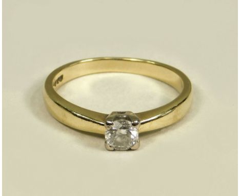 DIAMOND RING. An 18ct. gold solitaire diamond ring, the brilliant cut stone of approx. 0.25ct. spread, in a square setting. (