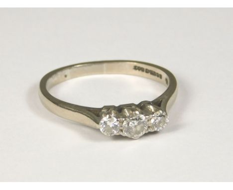 DIAMOND RING. An 18ct. white gold, three stone diamond ring. Approx. 3.7g. (P)