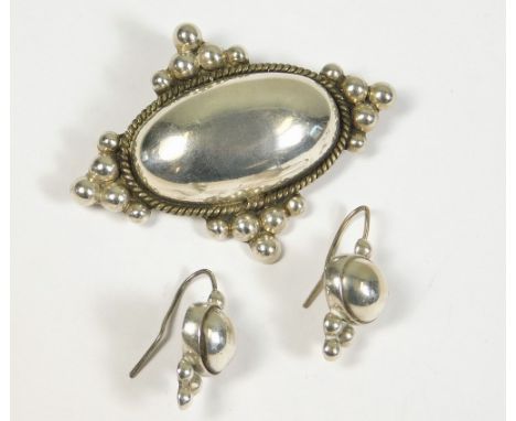 MEXICAN SILVER. A Mexican silver brooch with pendant loop &amp; a pair of matching earrings.