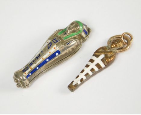 ENAMELLED CHARMS. An enamelled Egyptian sarcophagus charm, length 3.7cm (hinge with damage) &amp; one other enamelled charm w