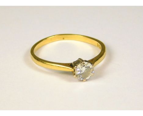 DIAMOND RING. An 18ct. gold solitaire diamond ring, the brilliant cut stone of approximately 0.75ct. spread. (Q/R)