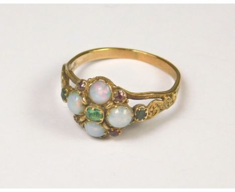 OPAL RING. A 19th century dress ring set with four cabouchon opals &amp; seven other coloured stones. (M)