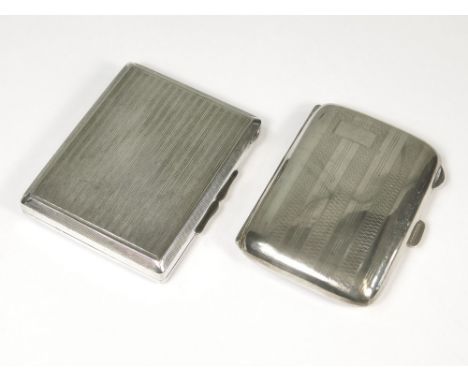 CIGARETTE CASE ETC.A 1930's curved, engine turned cigarette case & a 935 standard, engine turned card case. Total weight appr