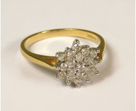 DIAMOND RING. An 18ct. gold diamond flower head cluster ring. Total diamonds approx. 0.50ct. (P/Q)