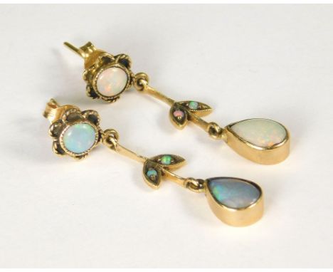 OPAL EARRINGS. A pair of 9ct. gold opal flowerhead &amp; leaf drop earrings. Length 3.5cm.