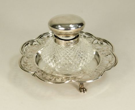 INK STAND. A silver mounted, hob nail cut glass inkwell in pierced dish stand. Sheffield 1902. Diameter of stand 14cm.