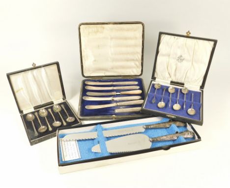 CASED SETS.A cased set of sterling silver demi-tasse spoons, a silver mounted bread knife & pie server set & two other cased 