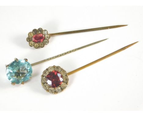 STICK PINS. Three various paste set stick pins.