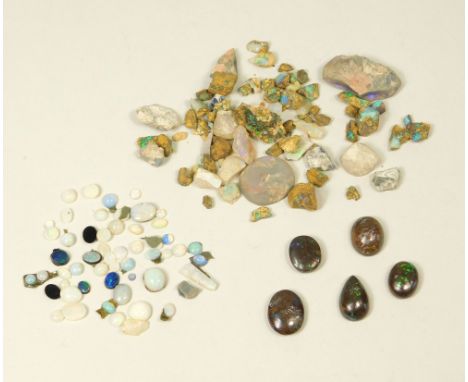 OPAL.Five specimens of polished boulder opal, other polished opal stones & a quantity of unpolished, uncut opal.