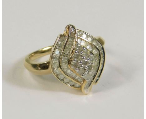 DIAMOND RING. A 9kt. cocktail ring set throughout with brilliant &amp; baguette cut diamonds, totalling approx. 1ct. (P)