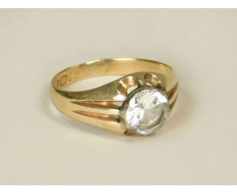 GOLD RING. A 9ct. gold ring set a large colourless stone.