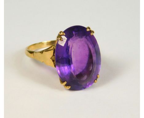 AMETHYST RING. A 9ct. gold amethyst dress ring, set a large faceted amethyst of good colour (S/T).