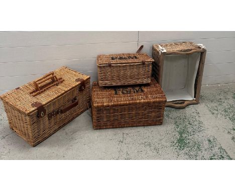 A selection of wicker items to include two graduating Fortnum and Mason hampers, a storage crate and a picnic hamper 