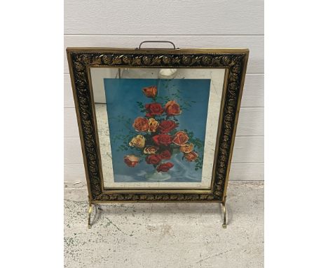 A fire screen with decorative panel featuring a display of roses 