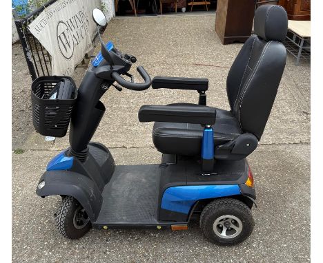 An Invacare mobility scooter with charger 