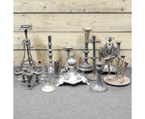 A collection of metal lamp bases and epergne parts