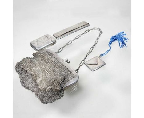 A silver stamp case, together with a silver cased comb, a silver vesta case and a chain mail purse (3)