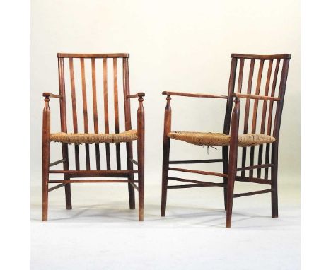 A pair of Arts and Crafts rush seated open armchairs, circa 1900, in the manner of William Morris for Liberty, each having a 