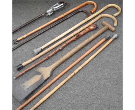 A collection of 19th century and later walking sticks, to include a shooting stick (8)