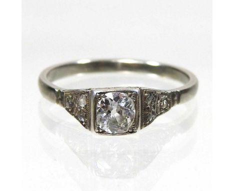 An early 20th century unmarked diamond ring, approximately 0.5 carats, with diamond set shoulders, size P