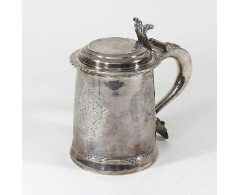 A rare Queen Anne Britannia standard silver tankard, of plain tapered shape, hinged lid with a scrolled thumbpiece and scroll