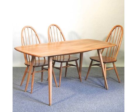 An Ercol light elm dining table, together with three Ercol light elm dining chairs (4)153 x 77 x 72cm