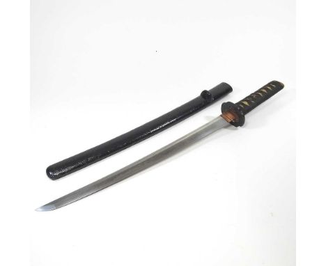 An early 20th century Japanese short sword, having a bound fishskin grip, with a mixed metal terminal, decorated with a bird 