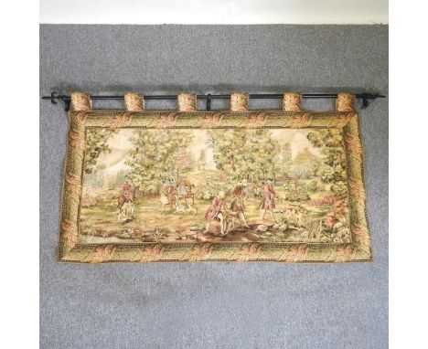 A modern hanging tapestry, depicting a hunting scene, suspended from a metal bar182w x 104h cm
