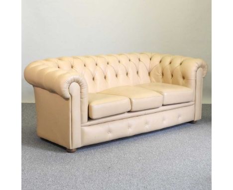 A cream leather upholstered button back three seater chesterfield sofa183w x 91d x 75h cm